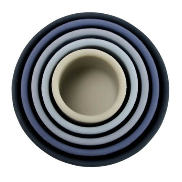 Blue silicone stacking cups | Bambino Eco Toys Top-down view of colorful concentric rings in shades of blue with a beige center.