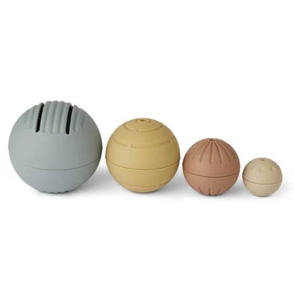 Four pastel silicone stress balls with grooved surfaces lined up left to right in varying sizes.