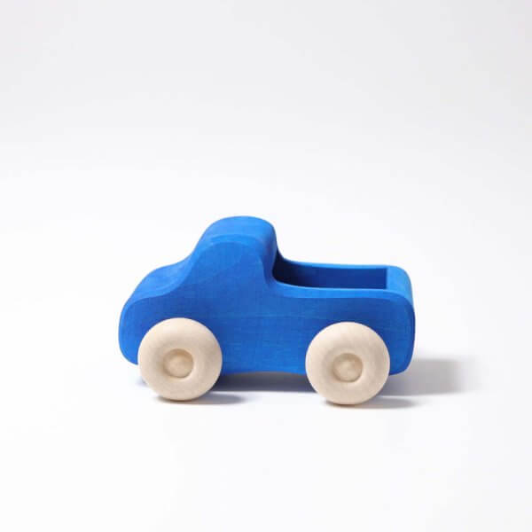 Blue wooden toy car with natural wood wheels on a white background, simple rounded design