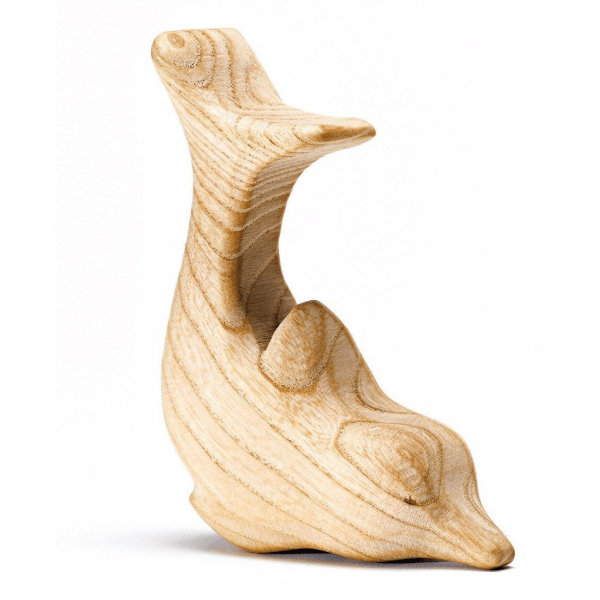 Wooden carved sculpture resembling a duck with a long neck and rounded body.