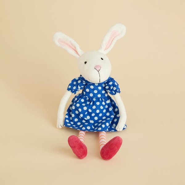 IMG_3183 | Bambino Eco Toys Soft white plush bunny in a blue polka-dotted dress with pink shoes against a pale beige background.